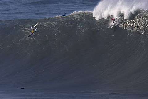 Unknown contestant drops into a very big wave at the Mavericks Surf Contest